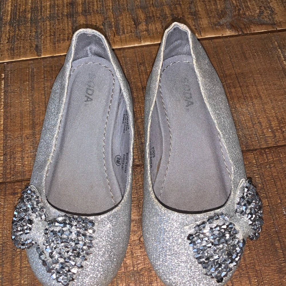 Silver metallic flats with bow detail